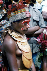 24 Young girl wearing a large display of Kina Shells 800
