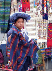 58 Woman offering textiles in the market place of Chichicastenango 800