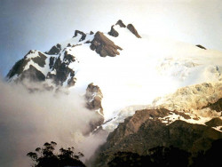 15 south american glacier peeking through the clouds at sunset in chile 800