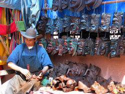8 Mask maker cleaning the dust off his masks 800