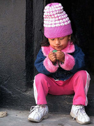 4 adorable child fascinated with a broken balloon